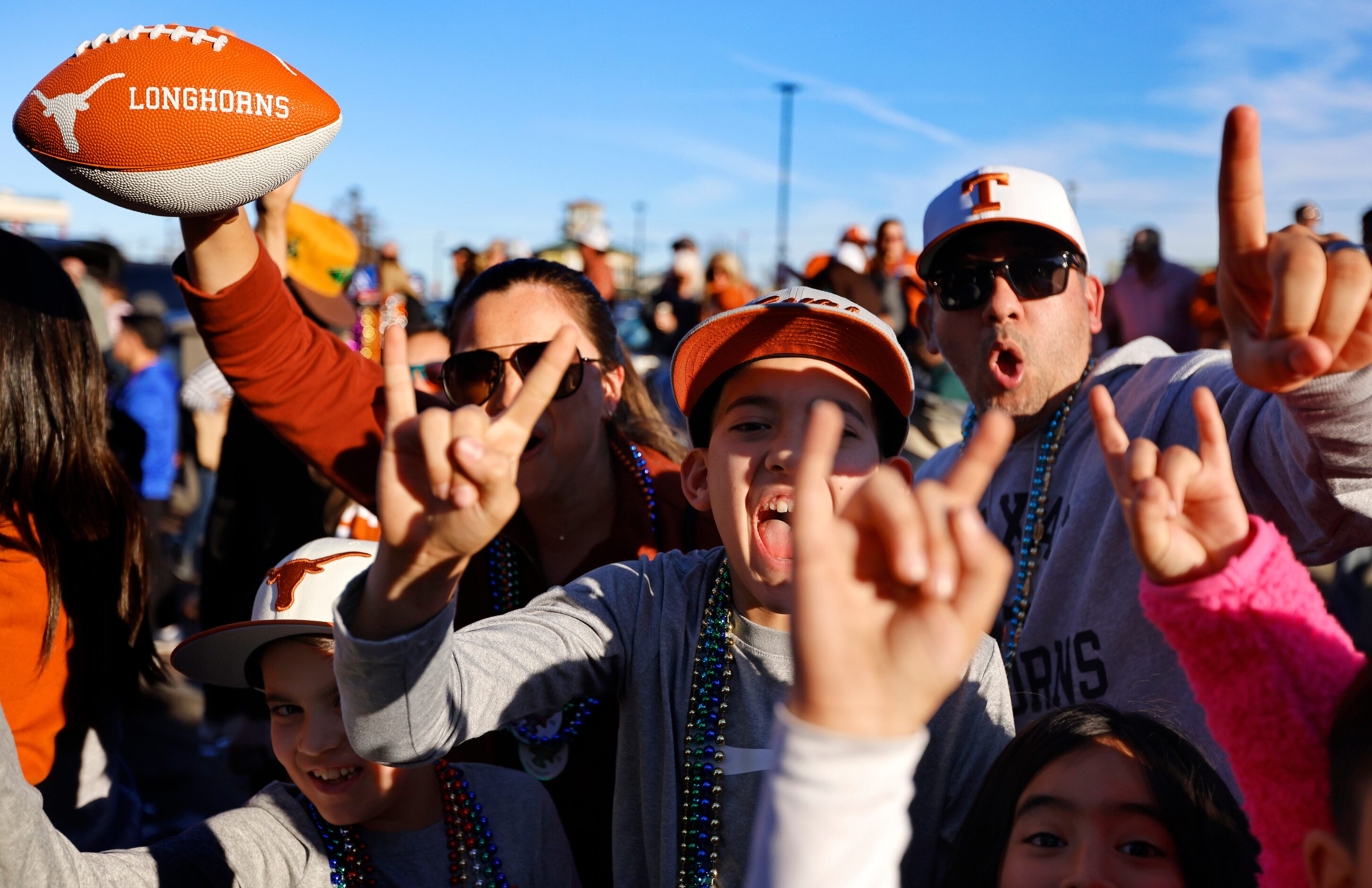 Texas Longhorns fans scream along Decatur St  during the Mardi Gras-style Allstate Sugar...