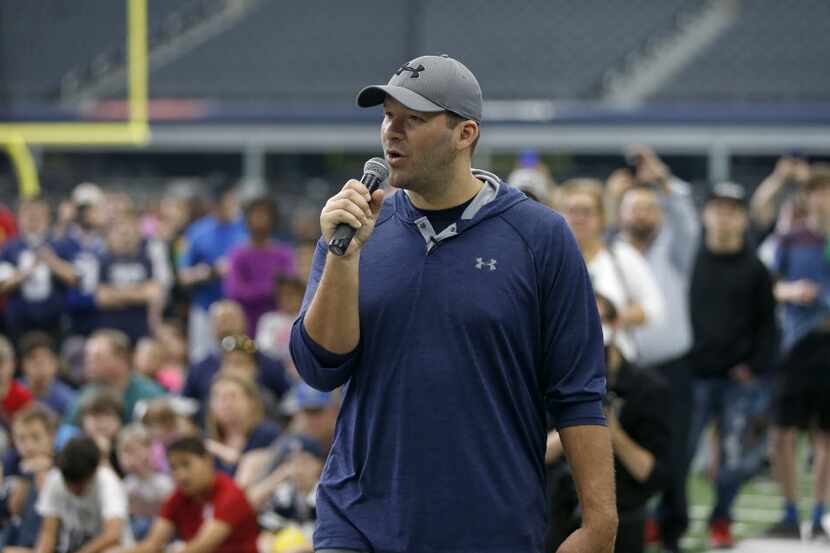 Cowboys quarterback Tony Romo speaks during the All Pro Dad promotional event at AT&T...