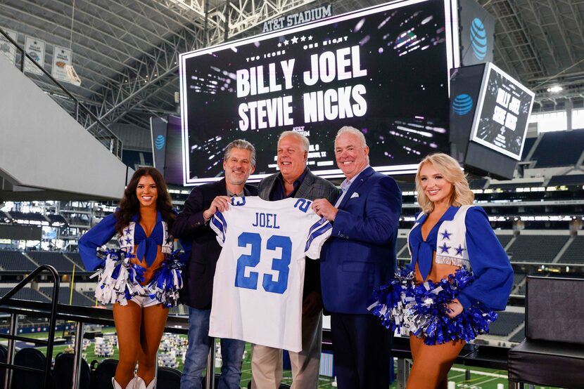 Dallas Cowboys Cheerleaders stand with Anthony Nicolaidis, Dallas Market President, Live...