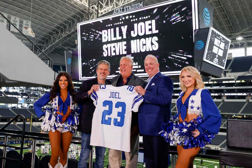 Dallas Cowboys Cheerleaders stand with Anthony Nicolaidis, Dallas Market President, Live...