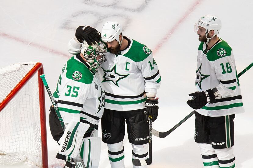 Goaltender Anton Khudobin (35), Jamie Benn (14) and Jason Dickinson (18) of the Dallas Stars...