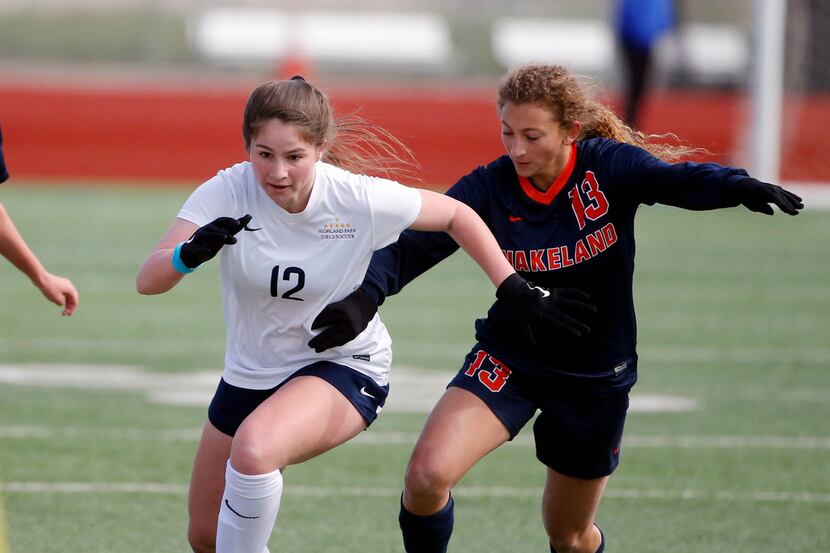 Highland Park's Halley Ray (12) fights for possession with Frisco Wakeland's Hannah Mandell...