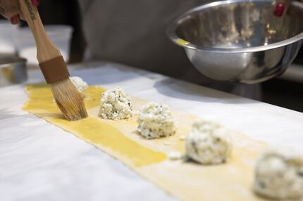 A student prepares ravioli at a Pirch cooking class at NorthPark Center in Dallas.