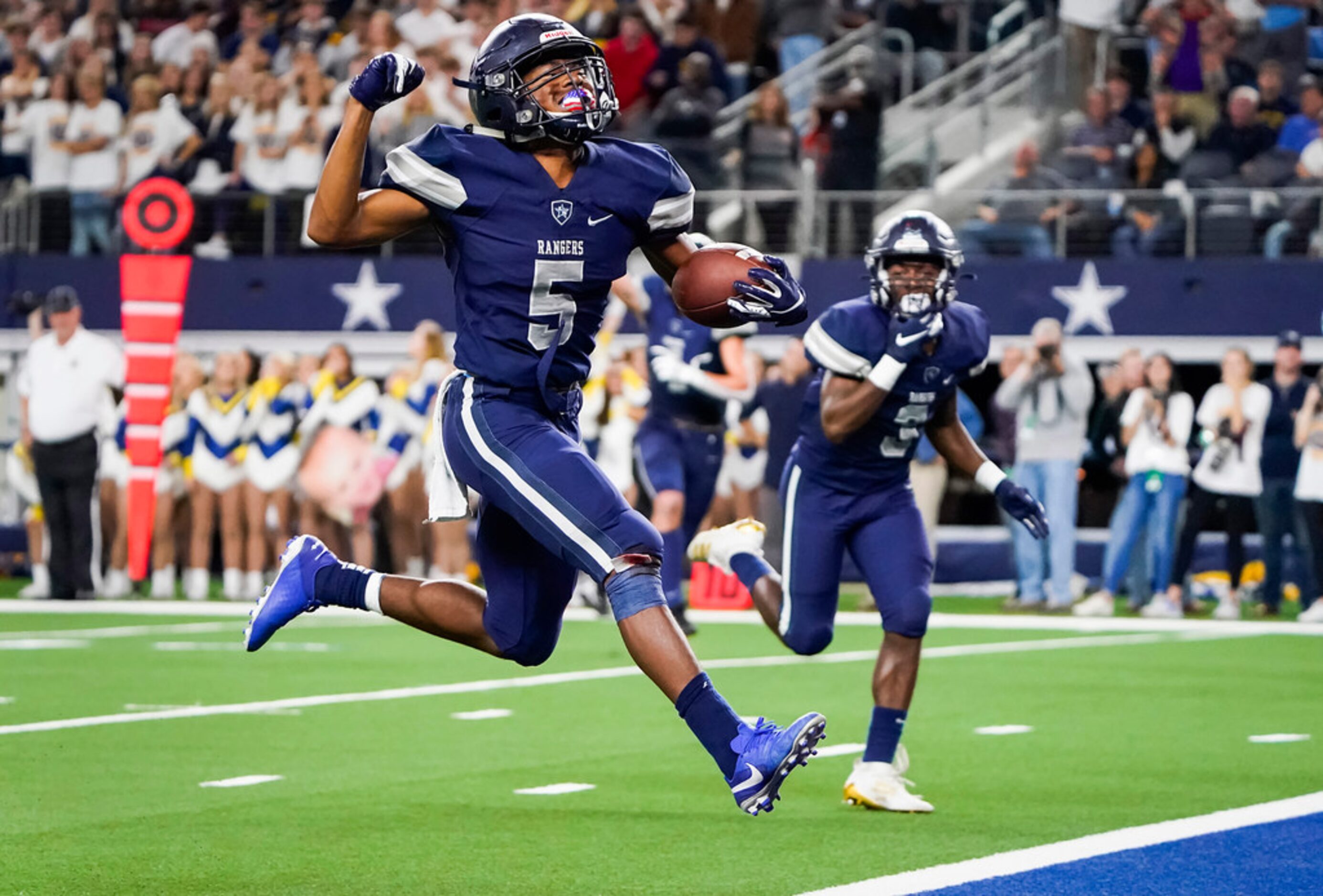 Frisco Lone Star running back Jaden Nixon celebrates as goes into to the end zone on an...