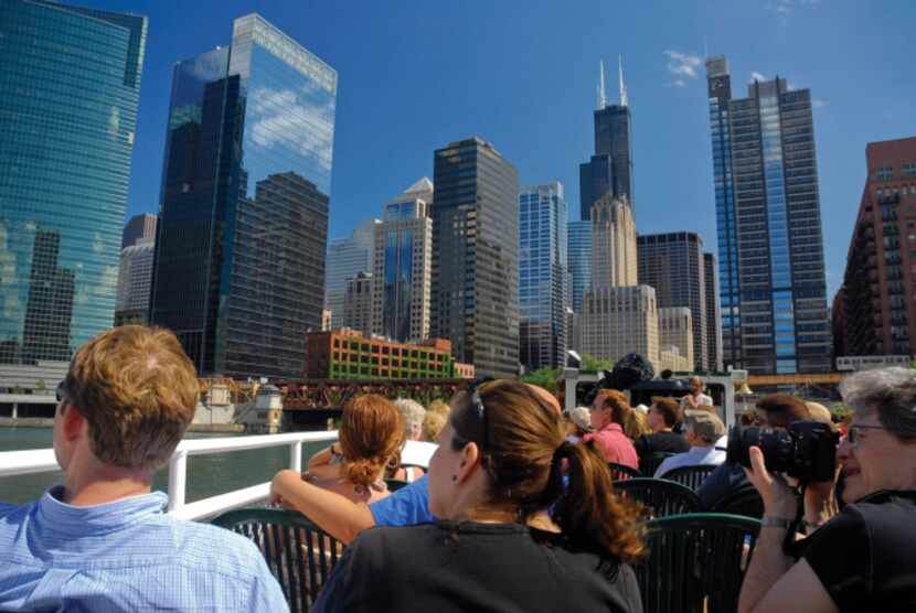 Passengers click away as tour boats course the Chicago River and its North and South Forks.