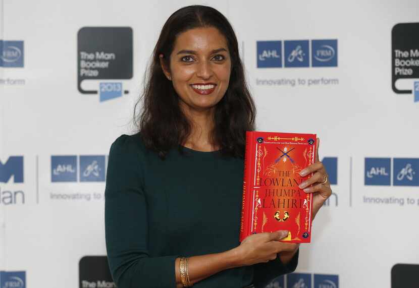  In this Oct. 13, 2013 file photo, author Jhumpa Lahiri poses with her book The Lowland in...