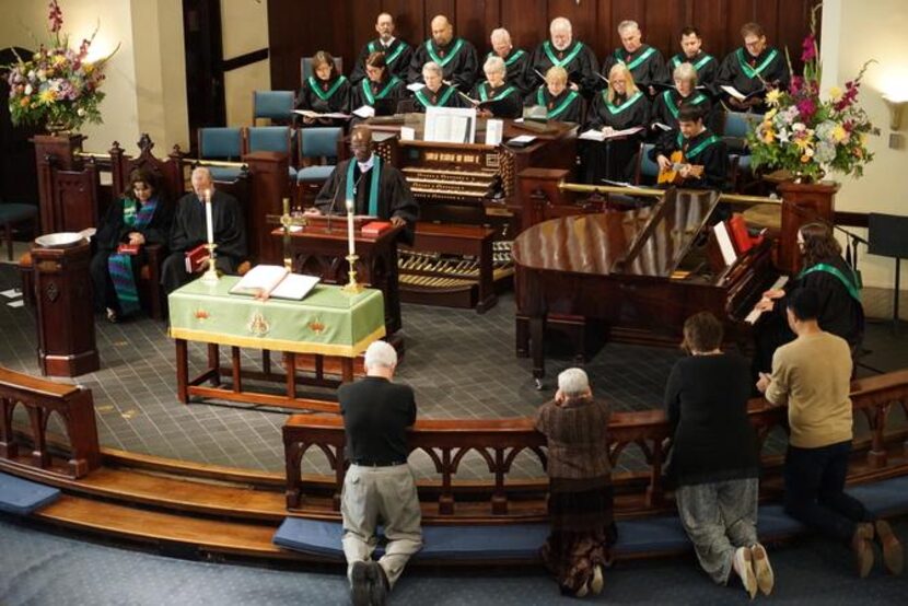 
Congregants gather to kneel and pray in the Sept. 14 church service.
