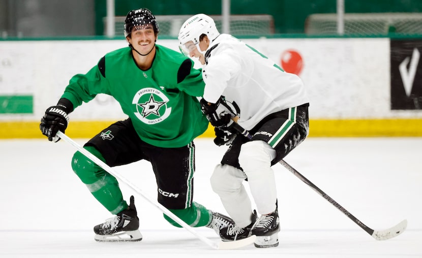 Dallas Stars center Wyatt Johnston (53, right) and left wing Mason Marchment (27) laugh as...