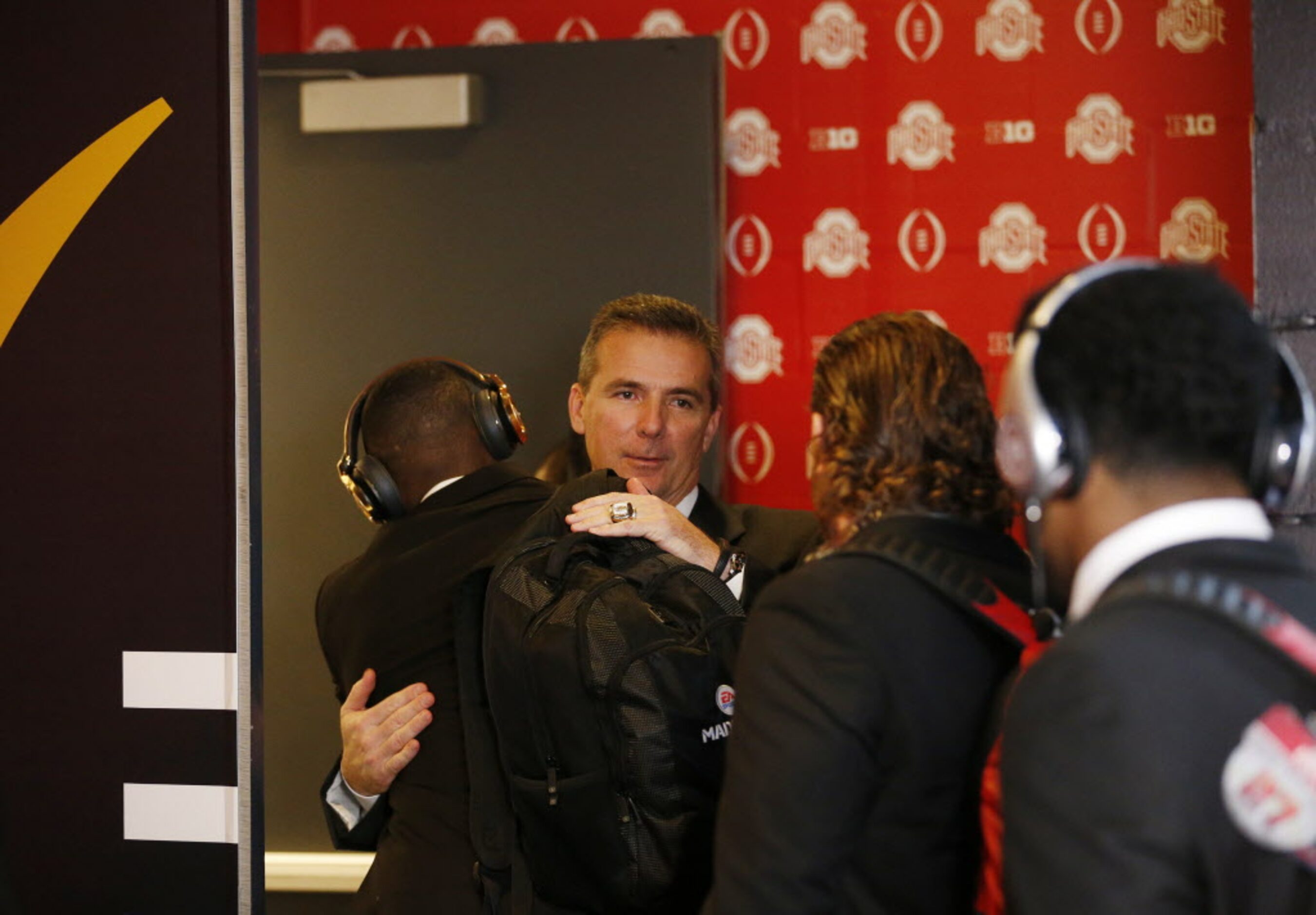 Ohio State Buckeyes head coach Urban Meyer welcomes his players to the locker room before...