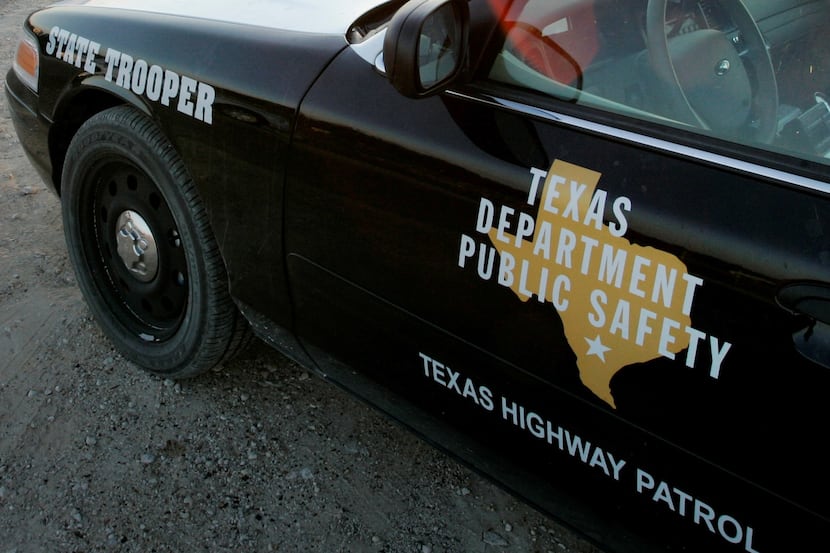 In this April 6, 2008, file photo, a Texas State Trooper is shown sitting in his vehicle in...