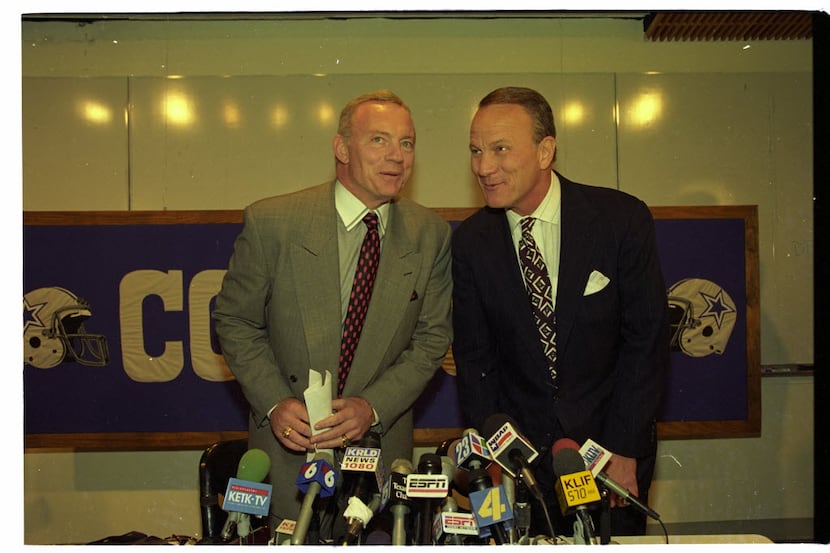 Shot March 30, 1994 - Jerry Jones, (L) and Barry Switzer chat with one another at a news...