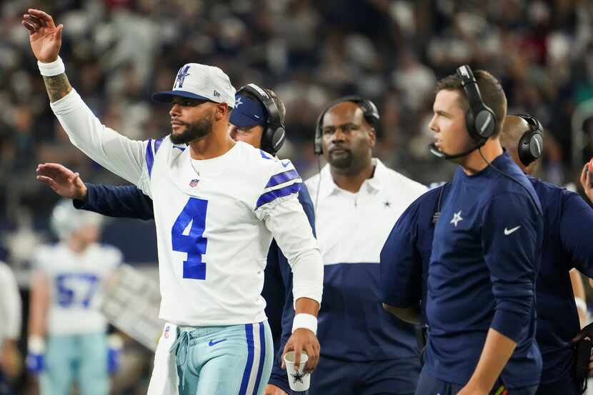 Dallas Cowboys quarterback Dak Prescott (4) celebrates a touchdown run by running back Tony...
