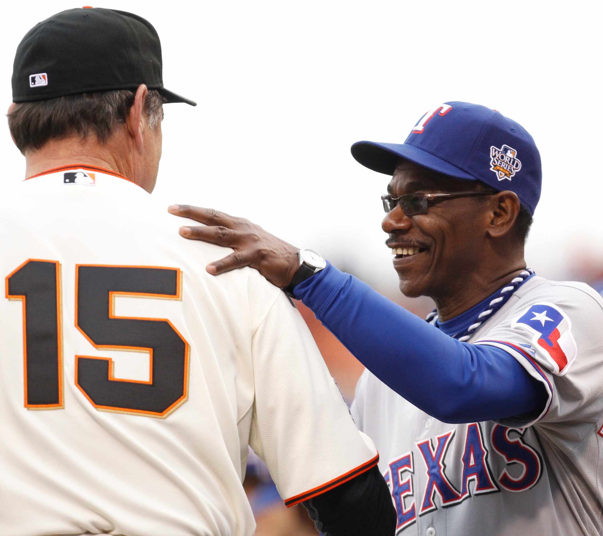 Texas Rangers manager Ron Washington talks to San Francisco Giants manager Bruce Bochy...