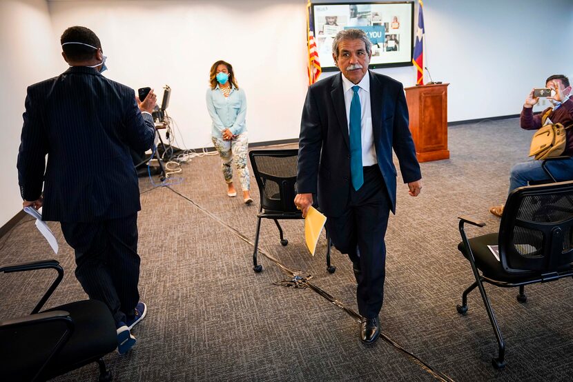 DISD superintendent Michael Hinojosa departs a press conference to provide updates on the...