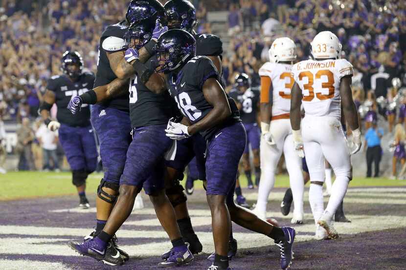 FORT WORTH, TX - NOVEMBER 04:  The TCU Horned Frogs celebrate the fourth quarter touchdown...