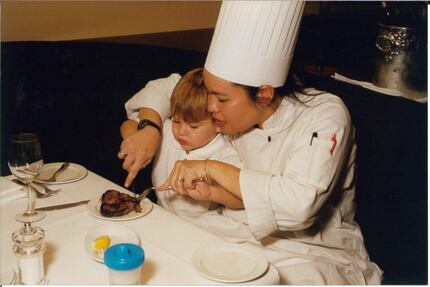 Sam Romano, pictured here as a preschooler when Nick & Sam's opened in Dallas, gets help...