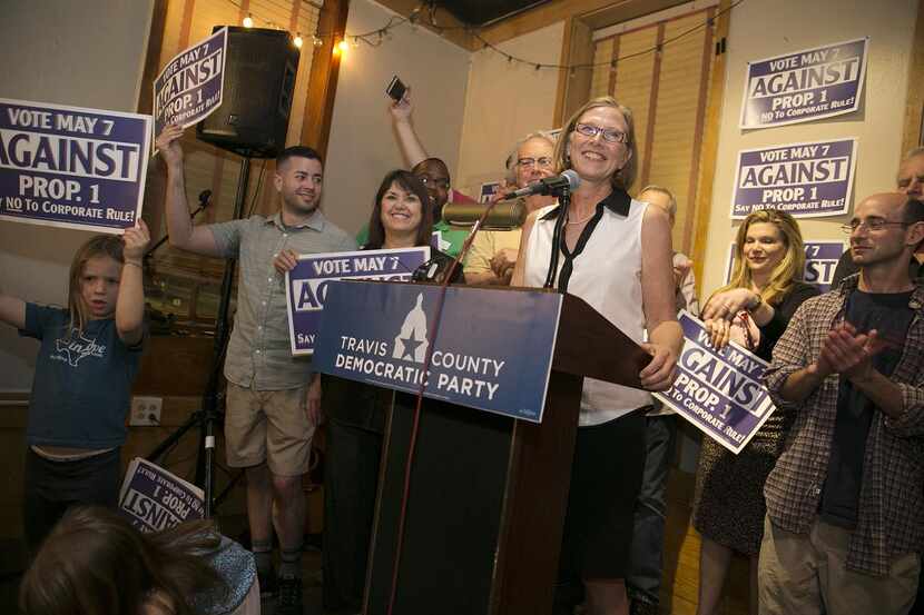 
Laura Morrison and others celebrate the defeat of Proposition 1 at Scholz Garten.
