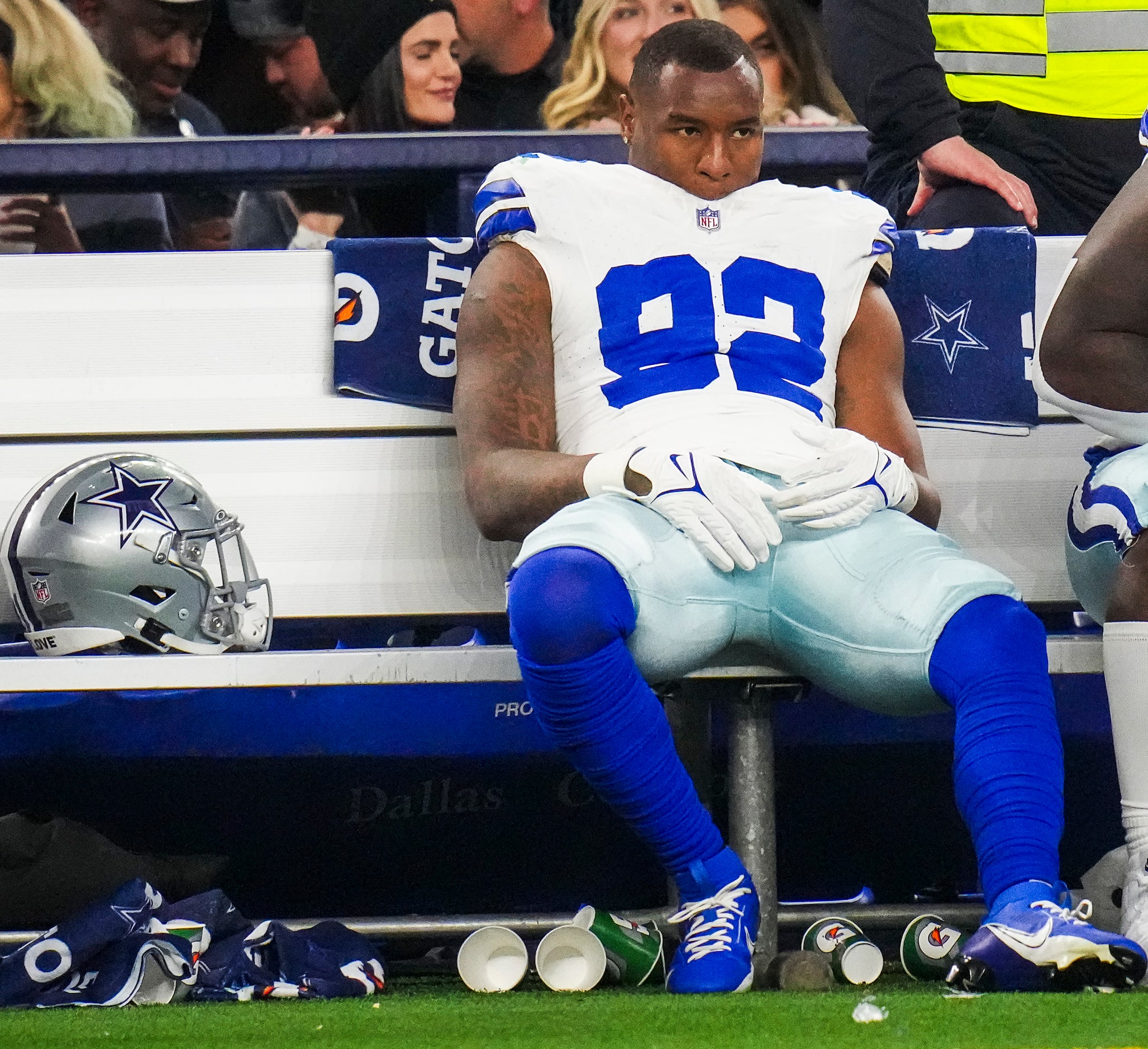 Dallas Cowboys defensive end Dorance Armstrong (92) looks on from the bench during the...