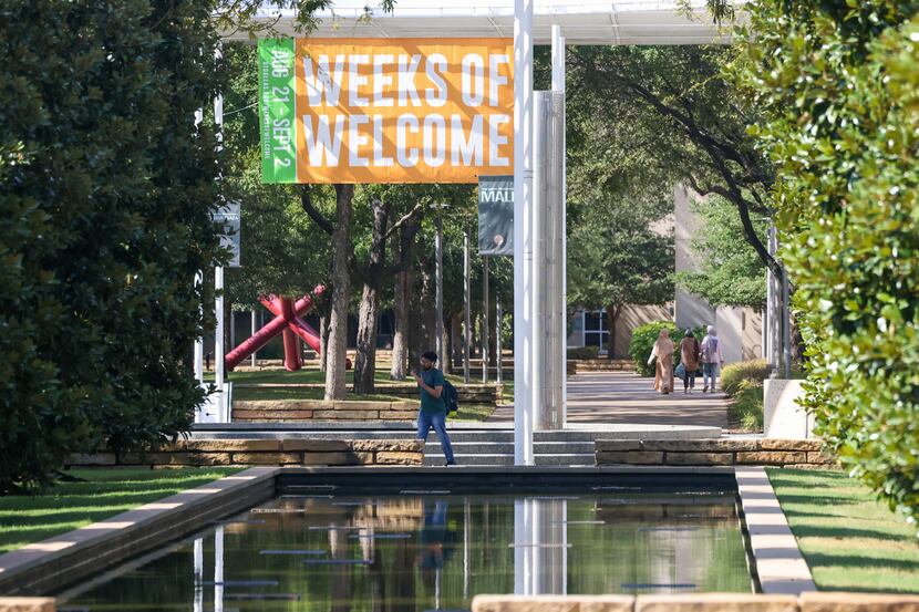 Students walk around the University of Texas at Dallas campus in Richardson on Thursday,...