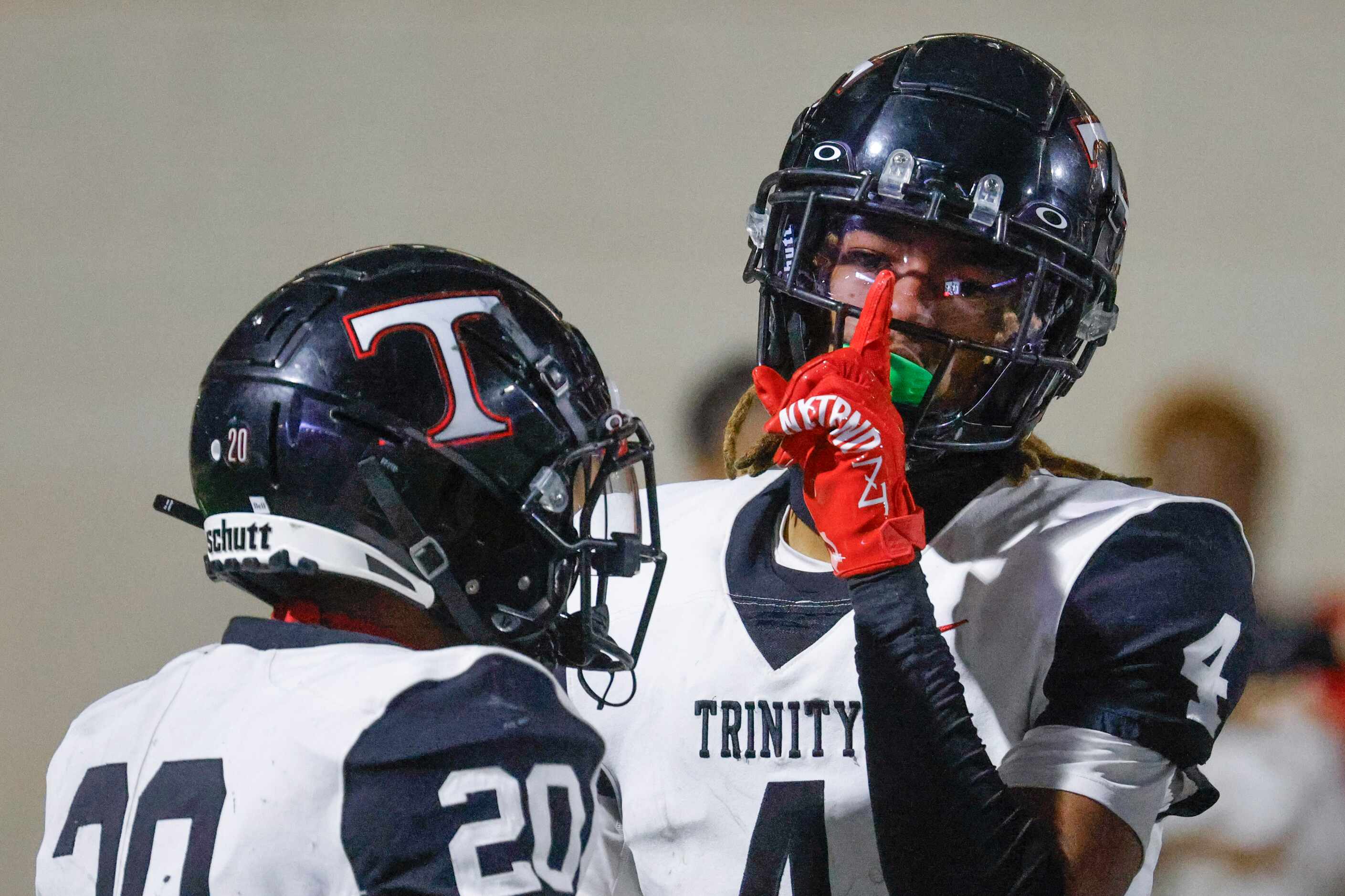 Trinity High’s Jarvis Heimuli celebrates after scoring a touchdown against Crowley High...
