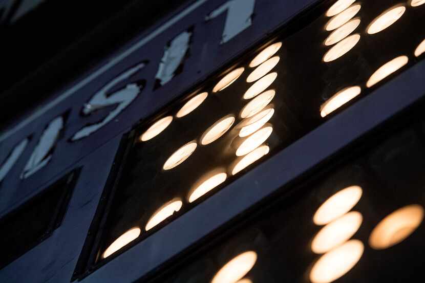 The scoreboard glows during the second half of a high school football game between Kimball...