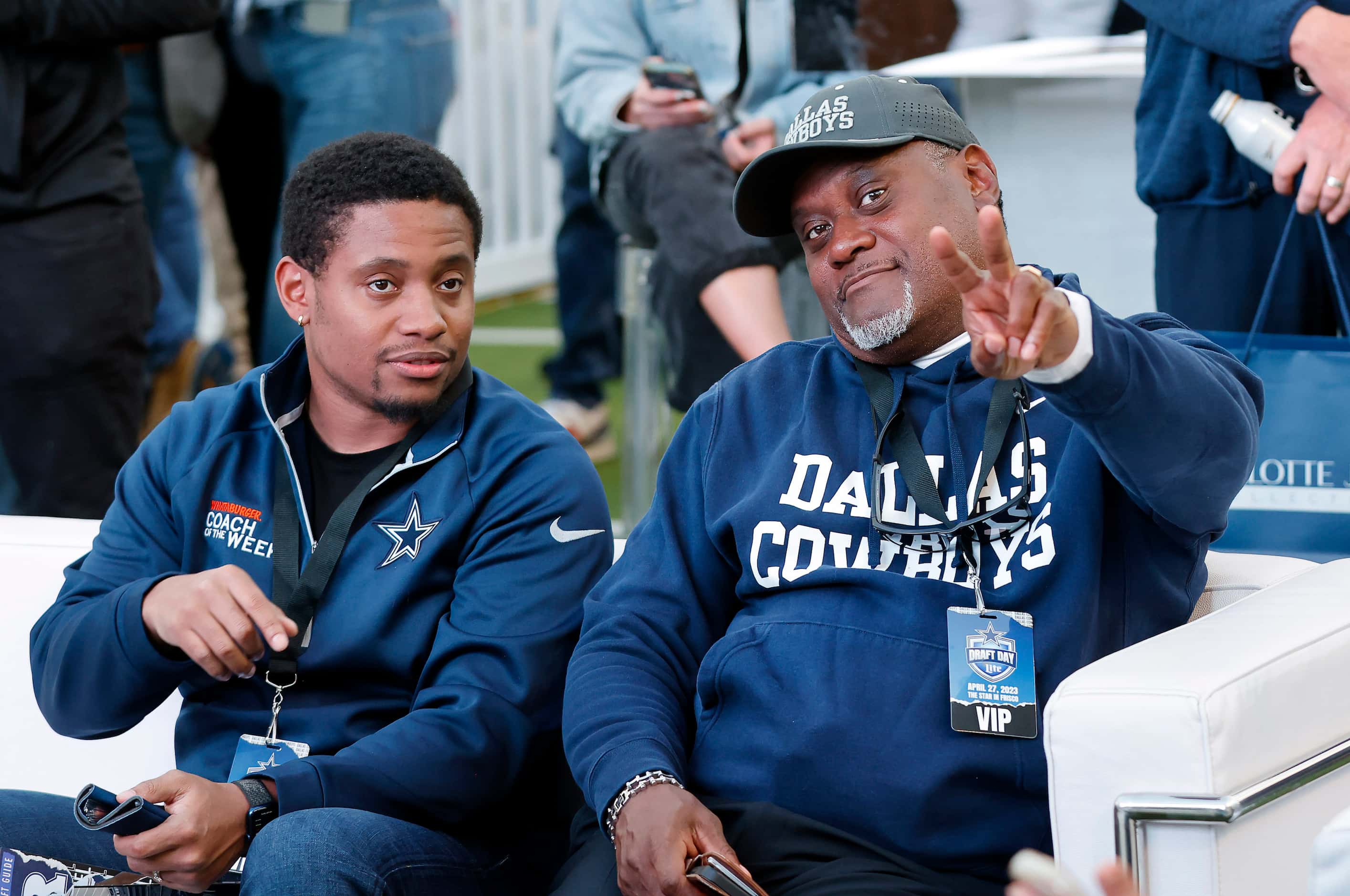 Former Dallas Cowboys football player George Teague (right) and his son James Teague hang...