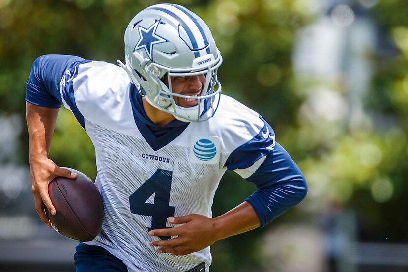 Dallas Cowboys quarterback Dak Prescott (4) takes off with the ball during the team's...