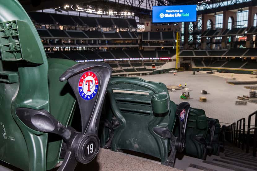 Seats have the Texas Rangers logo inside the new Globe Life Field on Wednesday, March 11,...