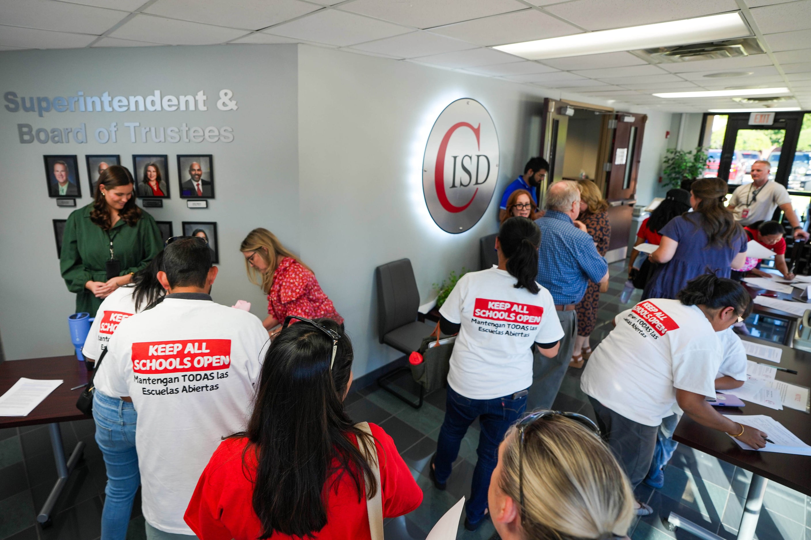 Parents sign up to speak during the Coppell ISD Board of Trustee meeting at the district...