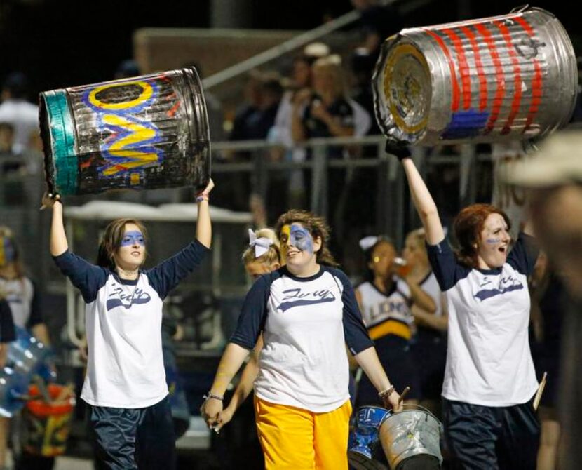 The Prestonwood spirit group "Fury" brings their trash cans to make noise to support the Lions.