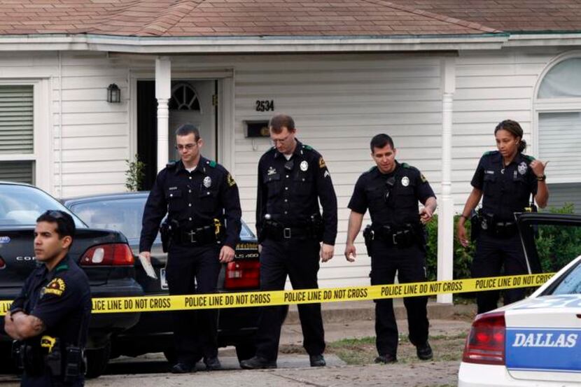 
Dallas police investigated a triple slaying in April at a home in the 2500 block of Western...