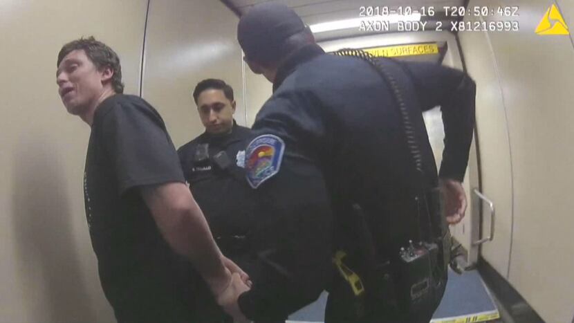 Justin Brafford is shown being arrested by police after his behavior forced a Dallas-bound...