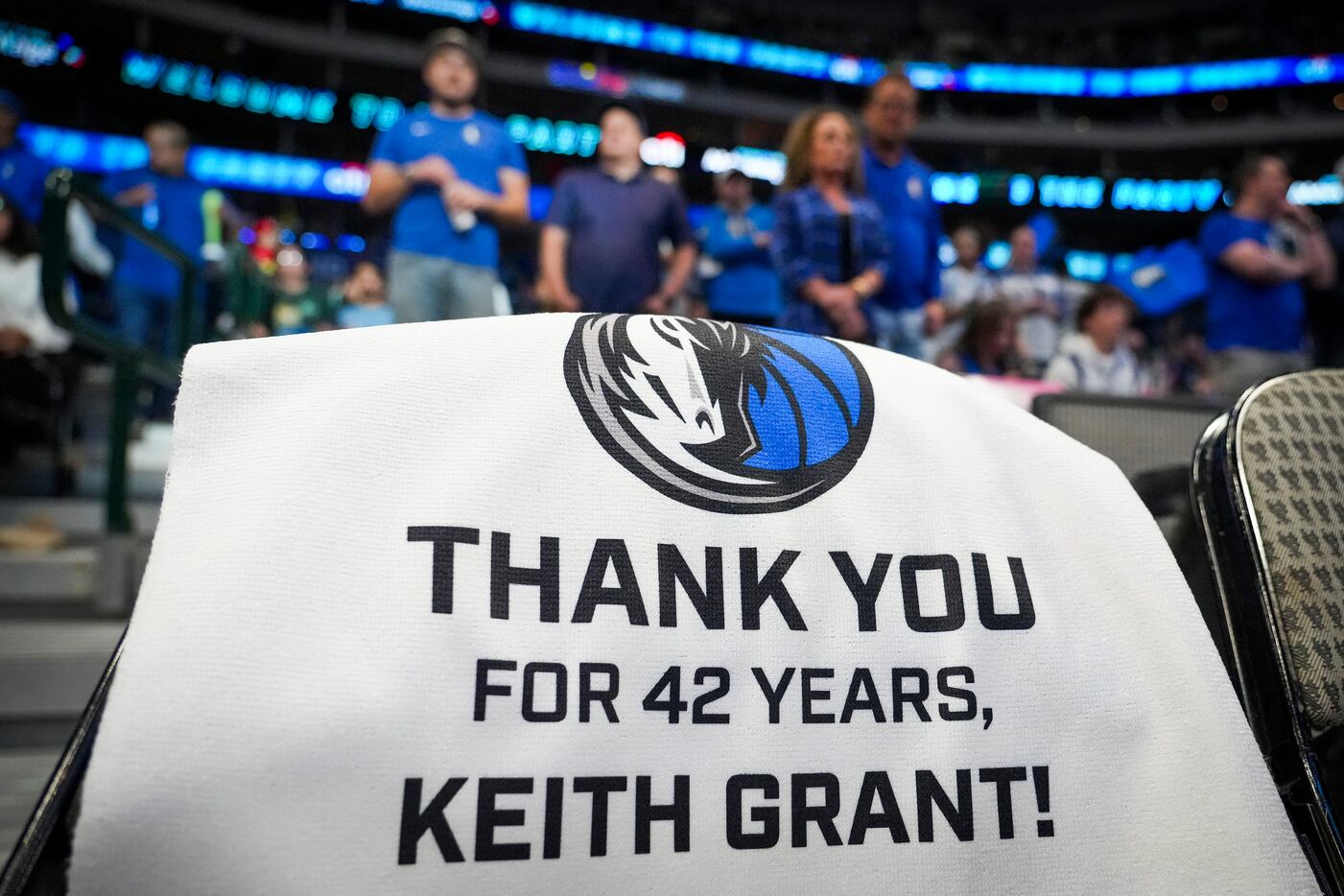 Towels honoring long-time Dallas Mavericks executive Keith Grant are set out on seats before...