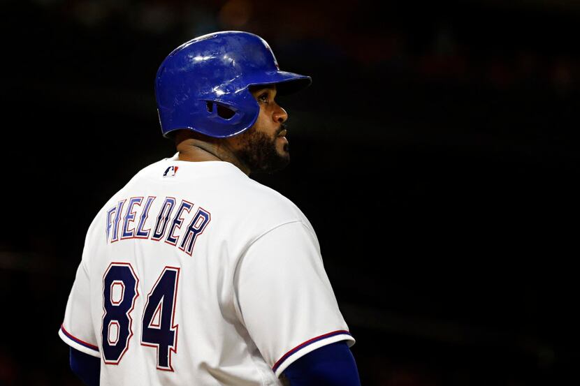 Texas Rangers designated hitter Prince Fielder looks up at the scoreboard during an 8-7 loss...