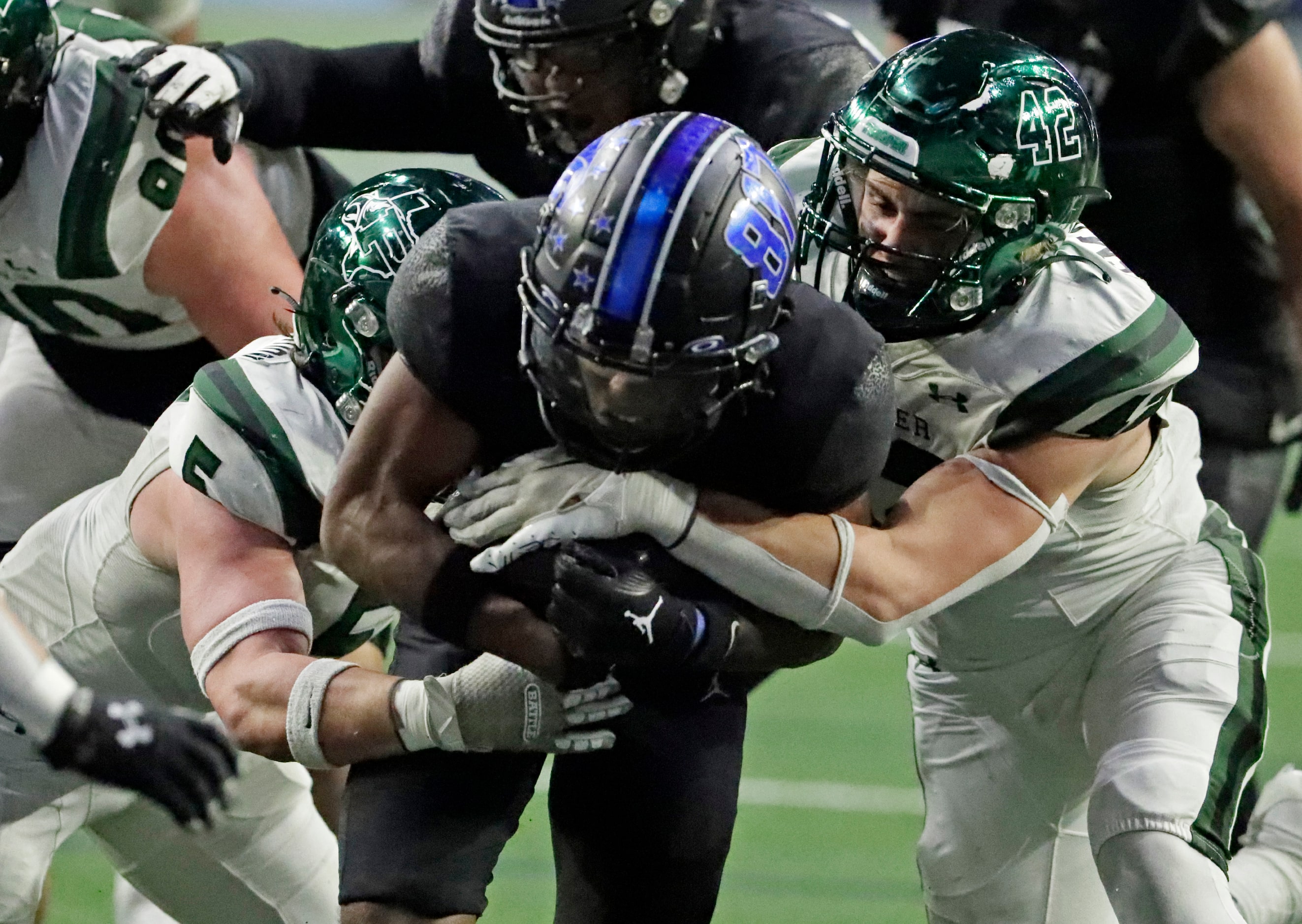 North Crowley High School running back Ashton Searl (8) goes through Prosper High School...