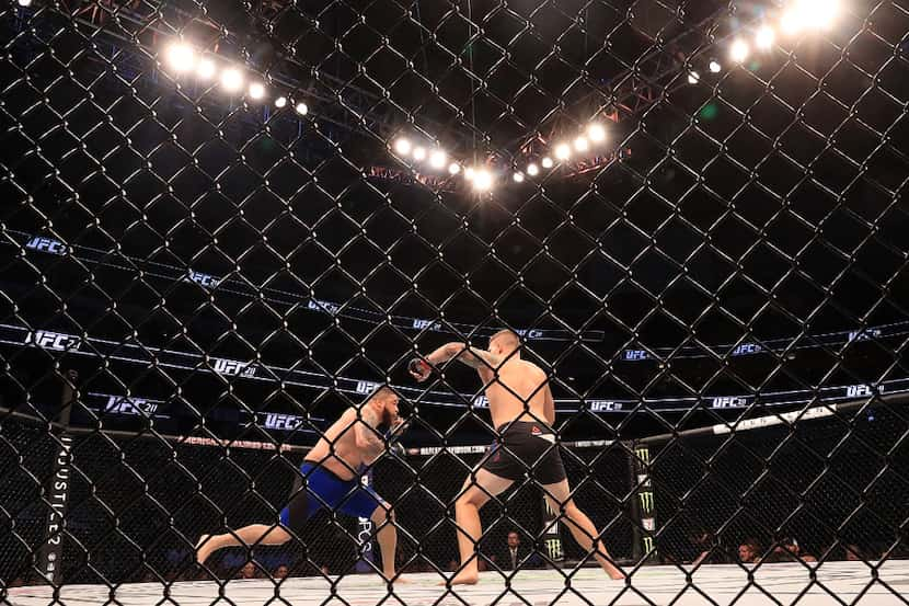 DALLAS, TX - MAY 13:  (L-R) Rashad Coulter fights against Chase Sherman in their Heavyweight...