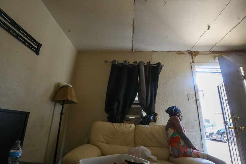 Patricia Heard, a tenant of the apartment complex that caught fire the night before, sits...