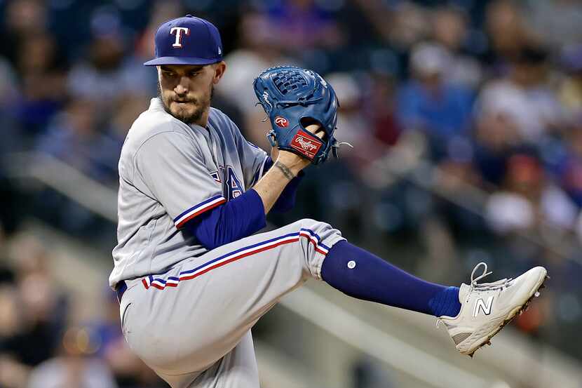 Texas Rangers pitcher Andrew Heaney winds up during the first inning of the team's baseball...