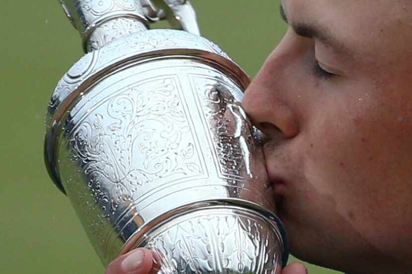 Jordan Spieth of the United States kisses the trophy after winning the British Open Golf...