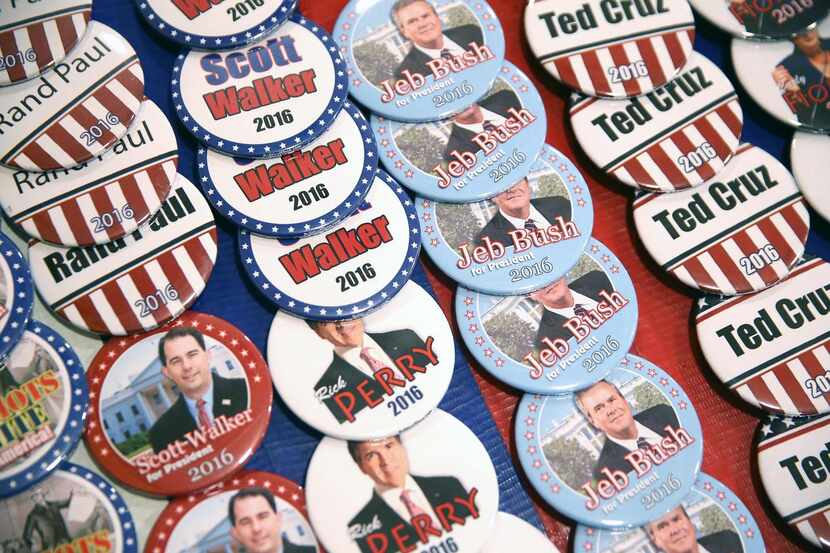 
At the Faith and Freedom Coalition forum, a vendor offered buttons for most candidates, and...