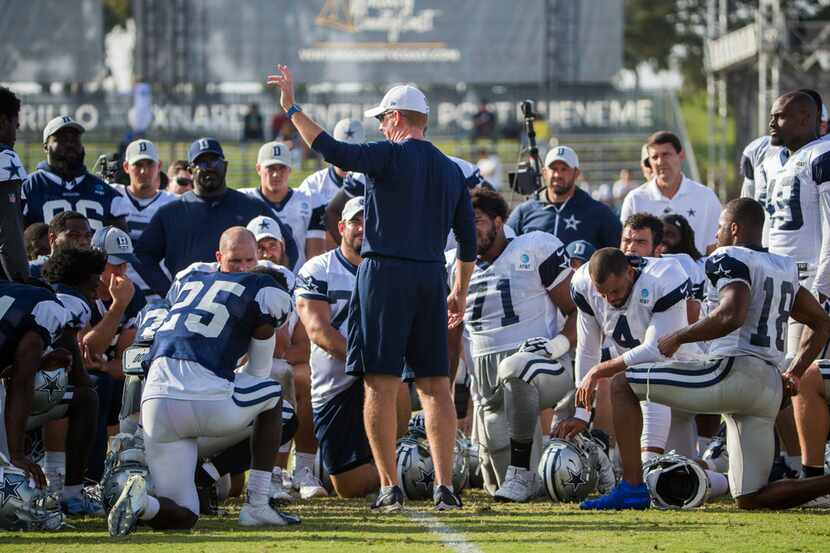 Dallas Cowboys head coach Jason Garrett talks to his team during an afternoon practice at...