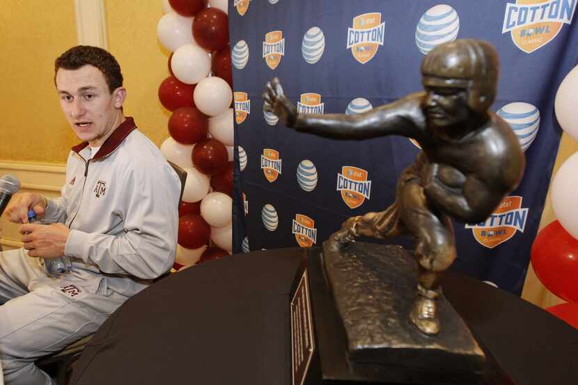 Texas A&M freshman quarterback Johnny Manziel answers questions during a Cotton Bowl press...