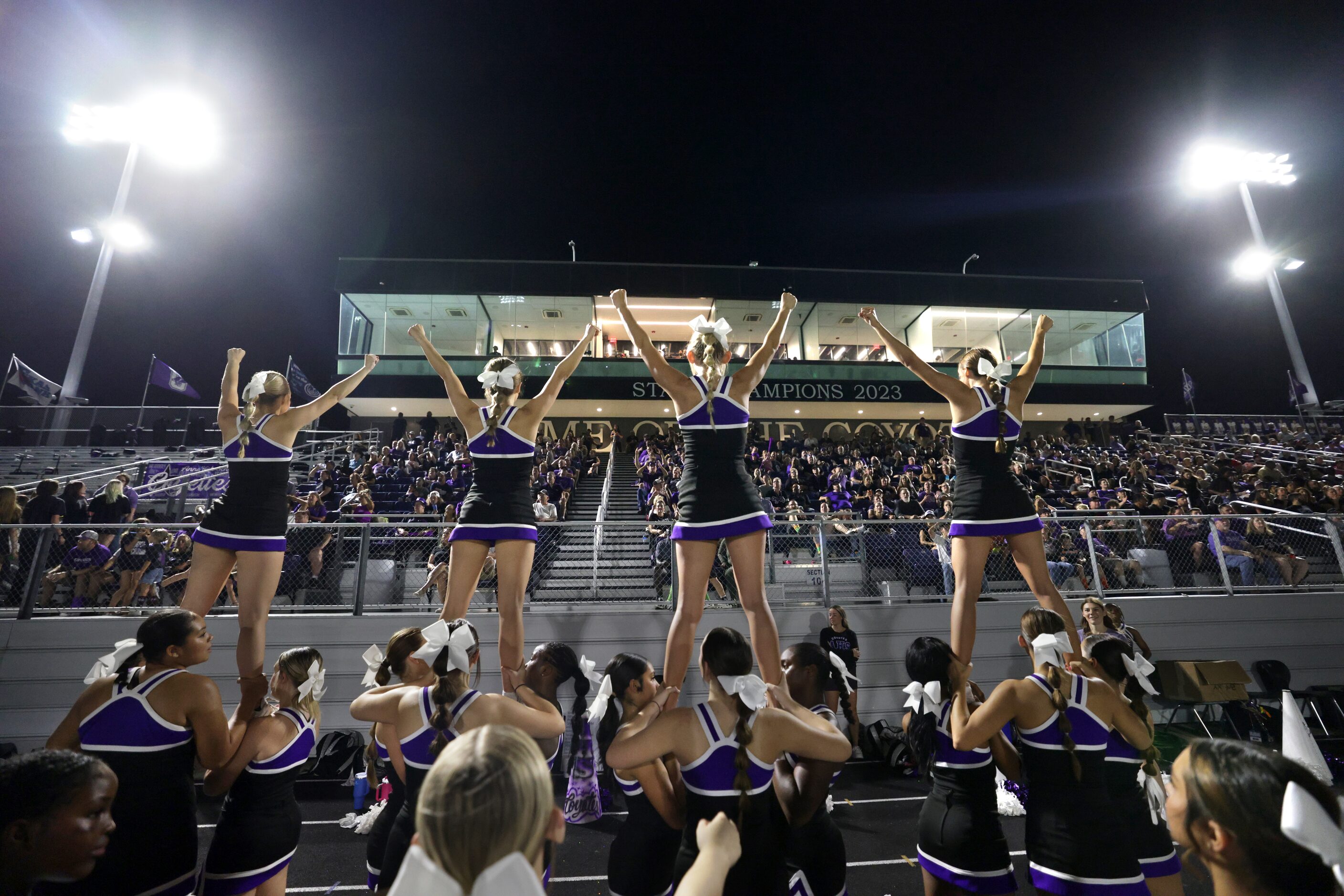 Anna cheerleaders perform during the Lovejoy High School at Anna High School football game...