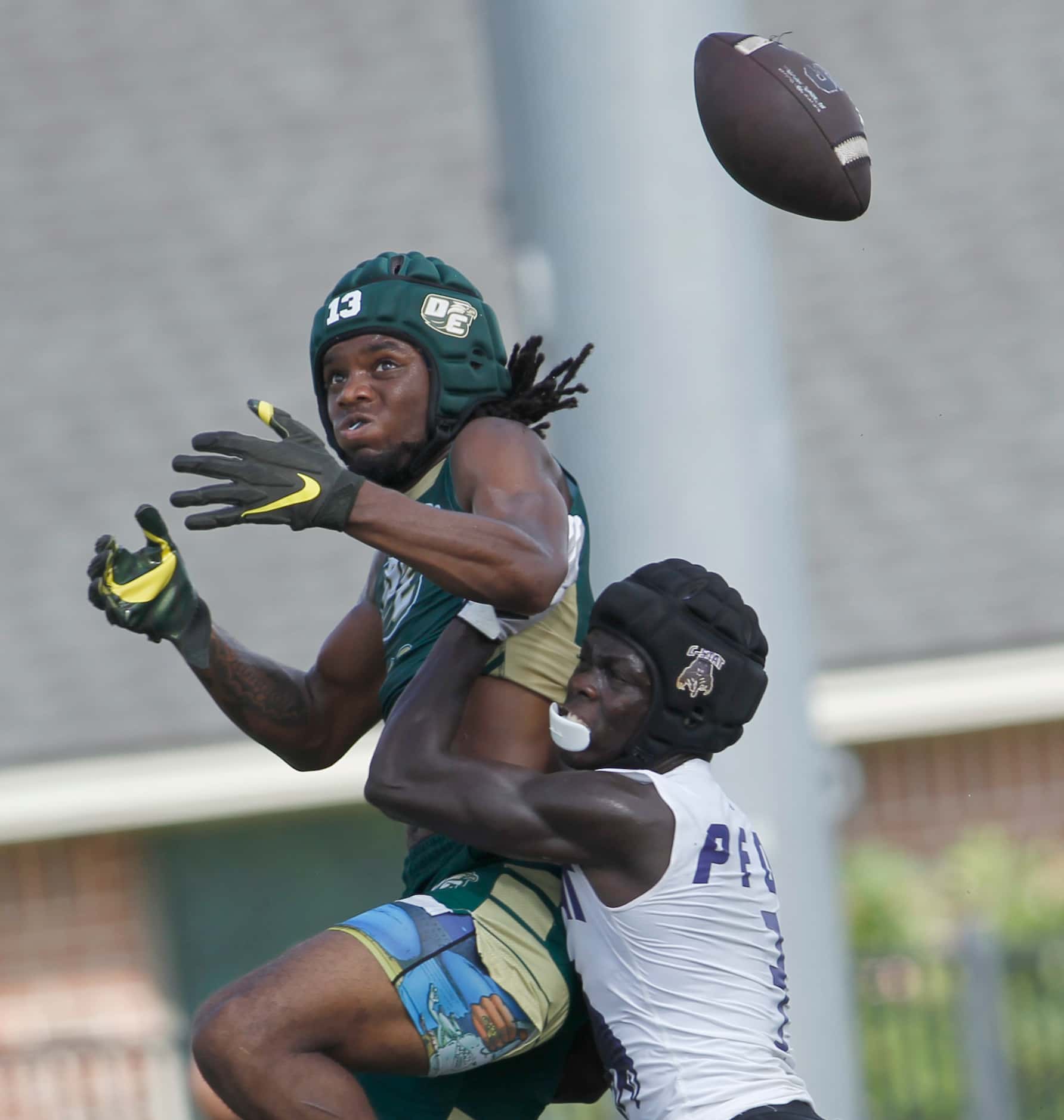 DeSoto receiver Daylon Singleton (13), top, has the ball knocked away by a College Station...