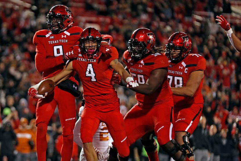Texas Tech players celebrate after Antoine Wesley (4) scored a touchdown during the second...