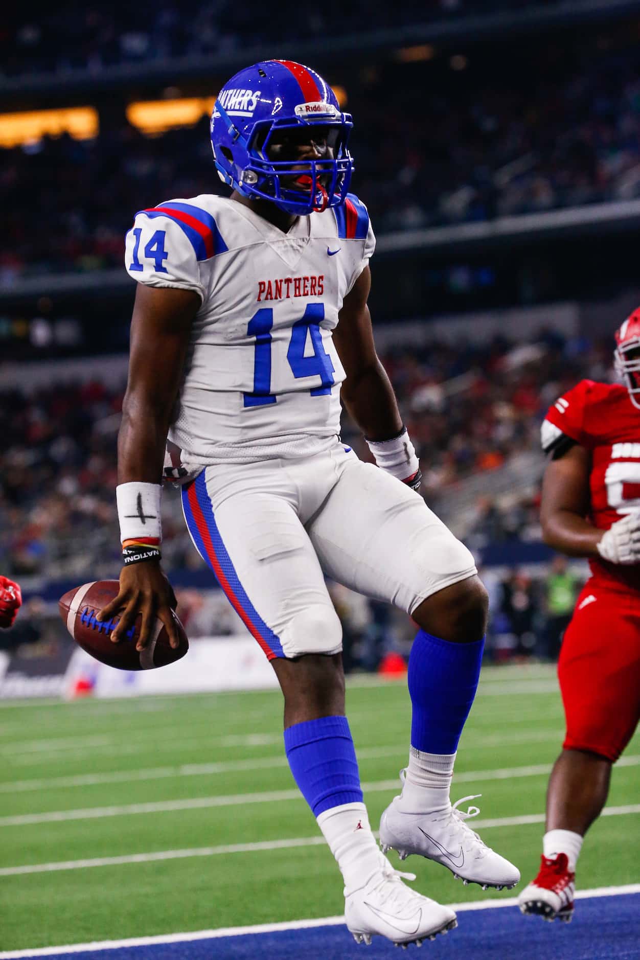 Duncanville's quarterback Chris Parson runs in for a touchdown in the second quarter of a...