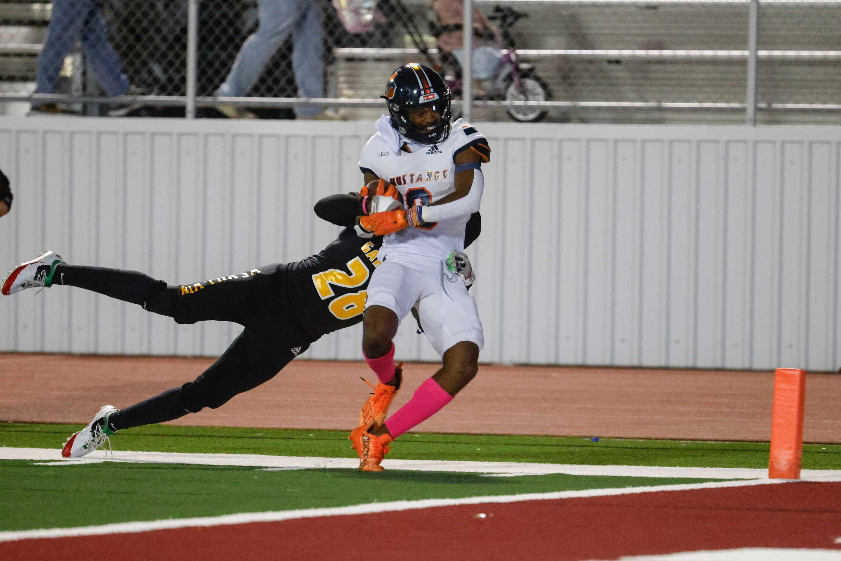 Sachse high school’s Josh Ridge (center) is tackled by Garland High school’s Aiden Onchweri...