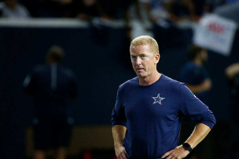 Dallas Cowboys head coach Jason Garrett watches practice in the Ford Center during training...