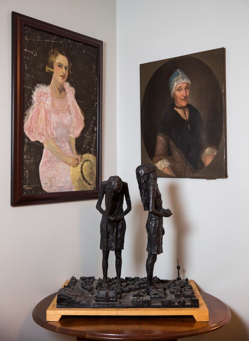 Painted portraits and a sculpture are displayed in the Austin home of authors Elizabeth...