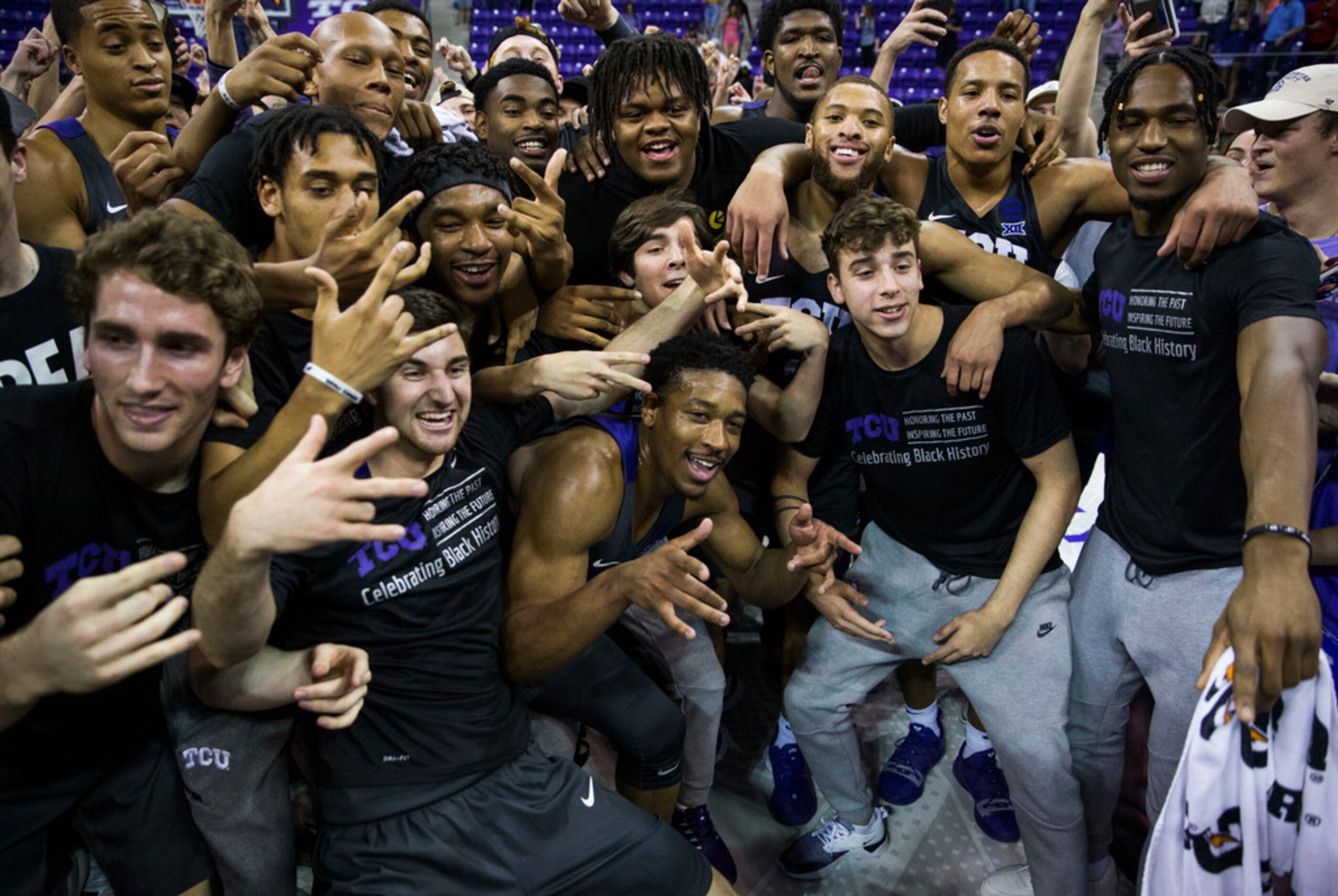TCU Horned Frogs celebrate after fans rush the court because of a 75-72 win over Baylor on...